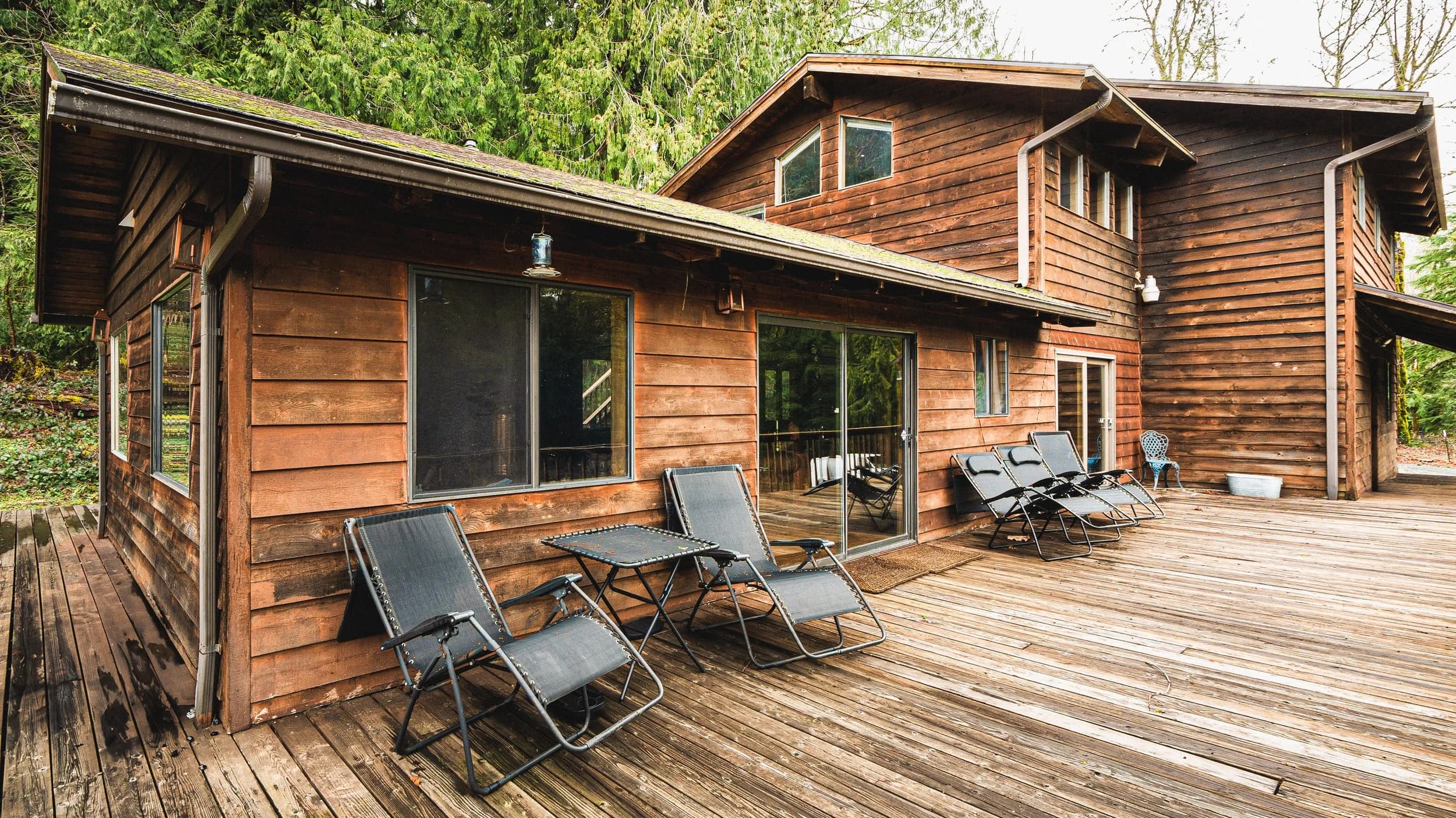 The Lodge's wrap-around deck with lounge chairs