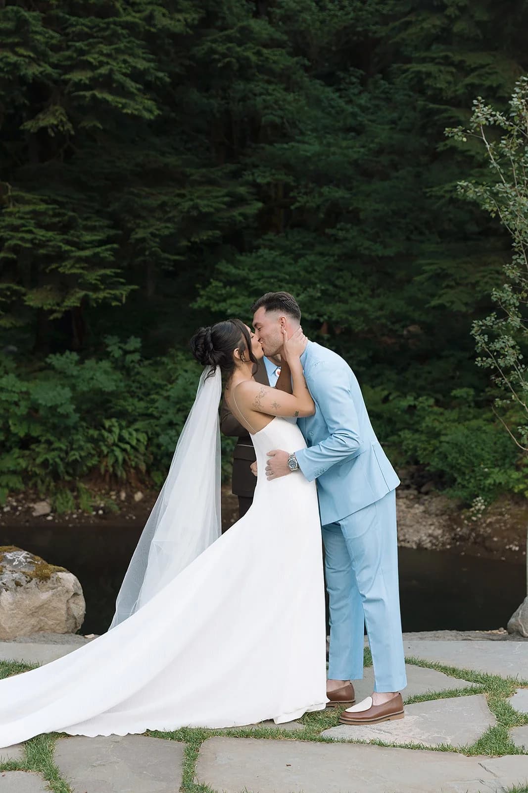 Olivia and Connor kiss on the flagstone after their ceremony